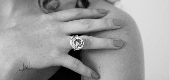 Woman wearing a golden ring with elegant design