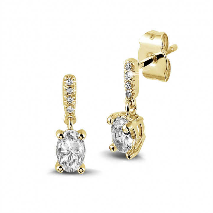 0.94 carat earrings in yellow gold with oval diamonds