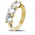 3.00 carat trilogy ring in yellow gold with round diamonds