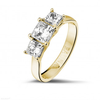 1.50 carat trilogy ring in yellow gold with princess diamonds