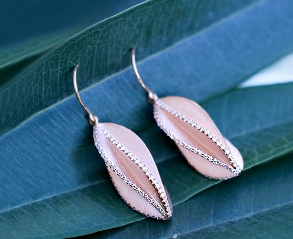 stylish earrings with intricate leaf detailing in rose gold, a must-have accessory