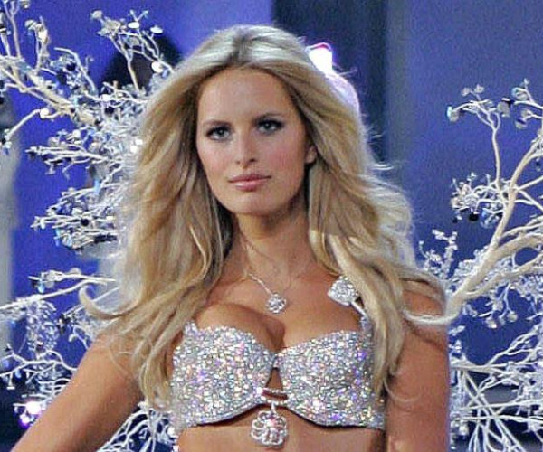 A Victoria Secrets model showcases a glamorous diamond bra on the runway, radiating elegance and bold fashion