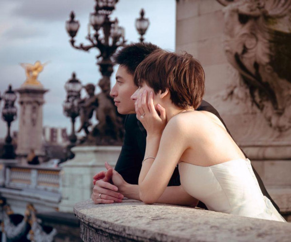 Bride and groom on a romantic bridge
