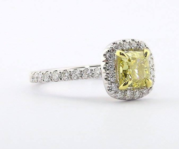 Diamond ring with fancy yellow diamond and small diamonds
