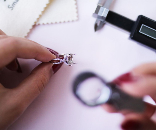 Person holding unfinished diamond ring