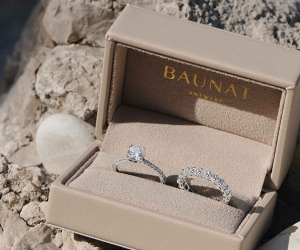 2 diamond rings in a box with stones