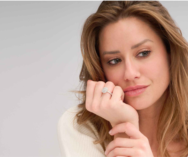 woman looking away and wearing a diamond ring