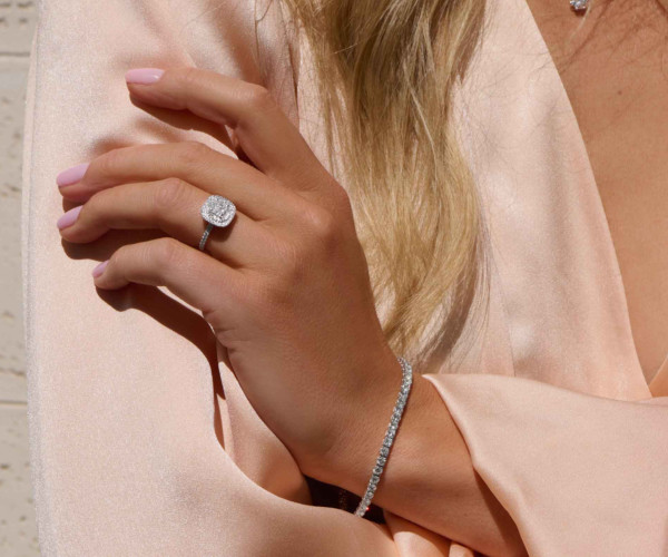 woman wearing a diamond ring and bracelet