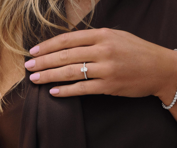 woman wearing diamond jewellery by BAUNAT