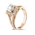 Anello solitario con diamante da 1,00 carati in oro rosso con diamanti laterali