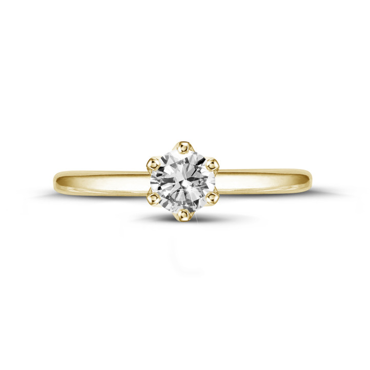 Anello solitario da 0,50 carati in oro giallo con diamante rotondo