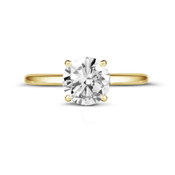 Anello solitario da 1,50 carati in oro giallo con diamante rotondo e quattro griffe