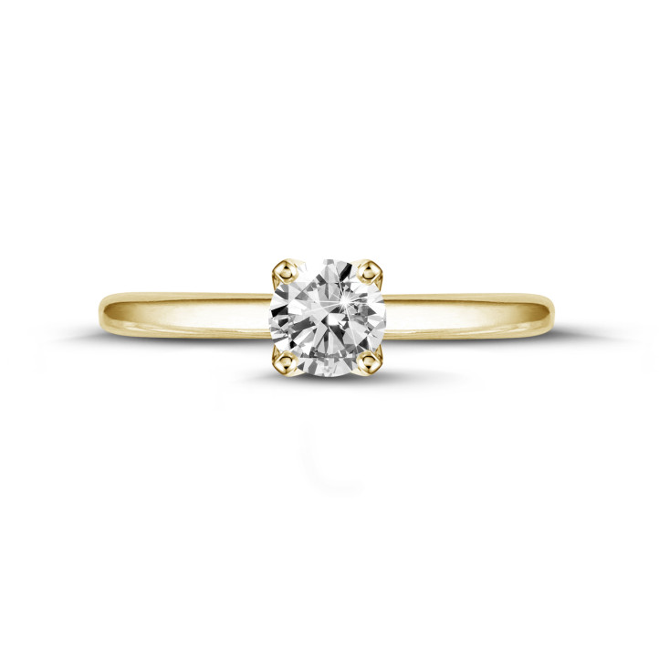 Anello solitario da 0,90 carati in oro giallo con diamante rotondo