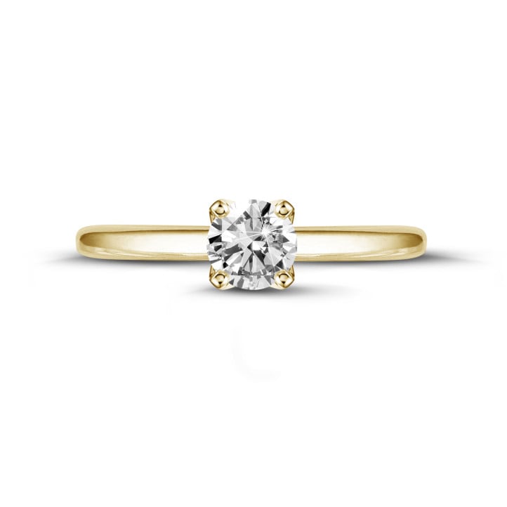 Anello solitario da 0,90 carati in oro giallo con diamante rotondo