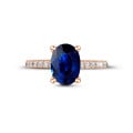 Anello in oro rosso con zaffiro ovale e diamanti laterali