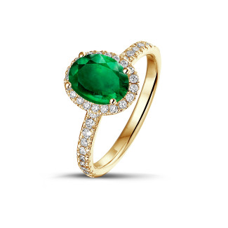 Anelli - Anello solitario Halo in oro giallo con smeraldo ovale e piccoli diamanti