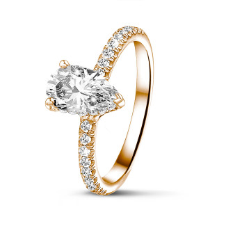 Anello solitario da 0,70 ct in oro rosso con diamante a goccia e alone nascosto
