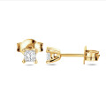 0.30ct Orecchini solitari in oro giallo con diamante taglio principessa
