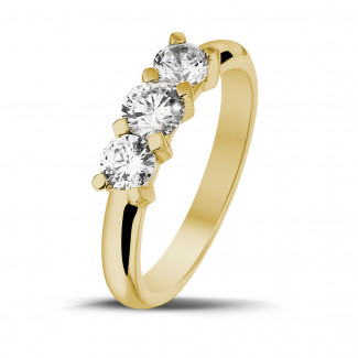 0.75 carat trilogy ring in yellow gold with round diamonds