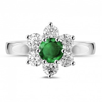 Anello Flowers in platino con smeraldo rotondo e diamanti laterali