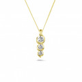 Pendente trilogy con diamanti da 0,57 carati in oro giallo