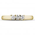 0.50 carat trilogy ring in yellow gold with round diamonds