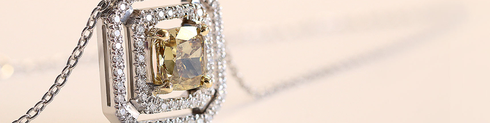 Cushion cut diamond Buy a cushion-cut engagement ring like the diamond in this necklace at BAUNAT.