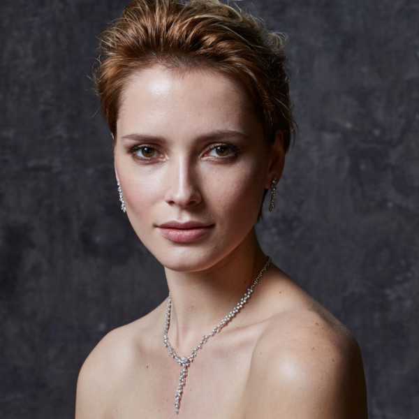 Woman wearing white gold necklace with marquise diamonds