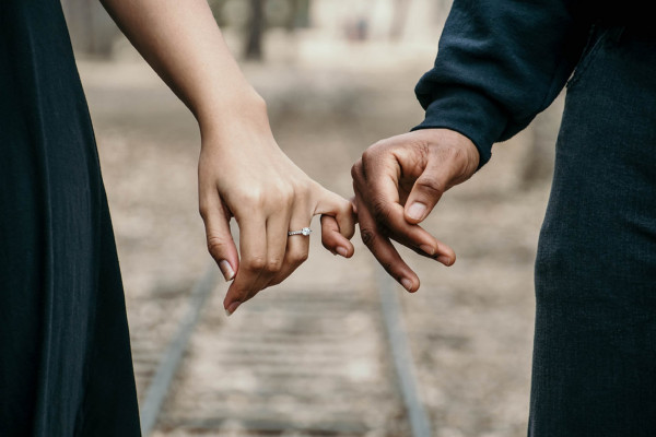 bride and groom holding hands