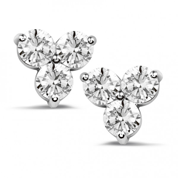 three stone diamond earrings in white gold on a white background