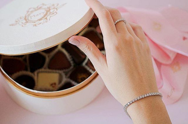 a women opening her jewellery box, wearing a stunning women’s bracelet