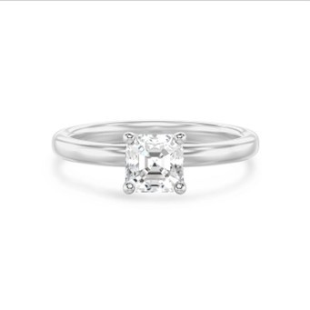 Un elegante diamante con taglio Asscher è esposto in primo piano, mettendo in risalto le sue sfaccettature e la sua purezza.
