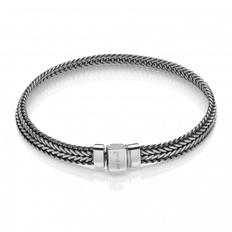 Elegant silver bracelet with a striking black and white pattern, designed with a convenient magnetic clasp.