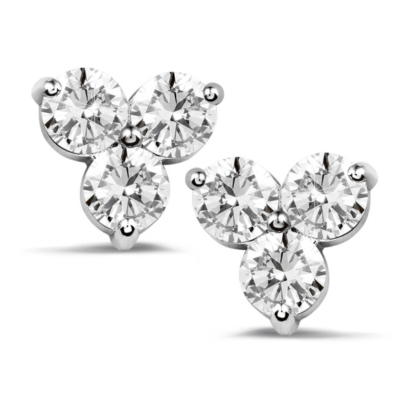 three stone diamond earrings in white gold on a white background