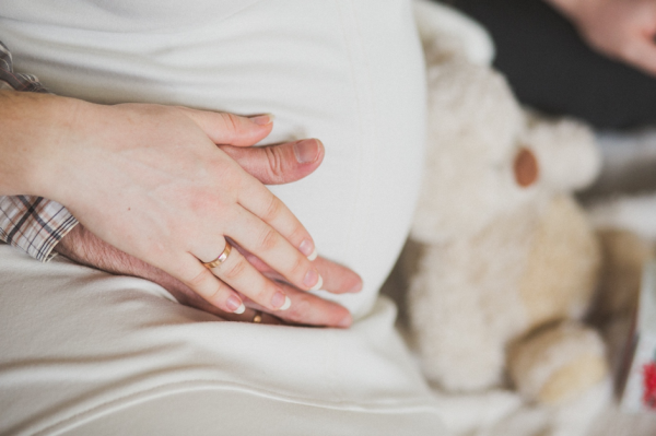 You are advised to remove your rings if you are pregnant - BAUNAT - pregnant person wearing a ring, making her more vulnerable to a ring getting stuck on a finger