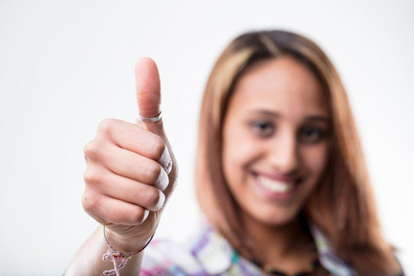 a woman wearing a ring on the thumb showcasing ultimate confidence and independence