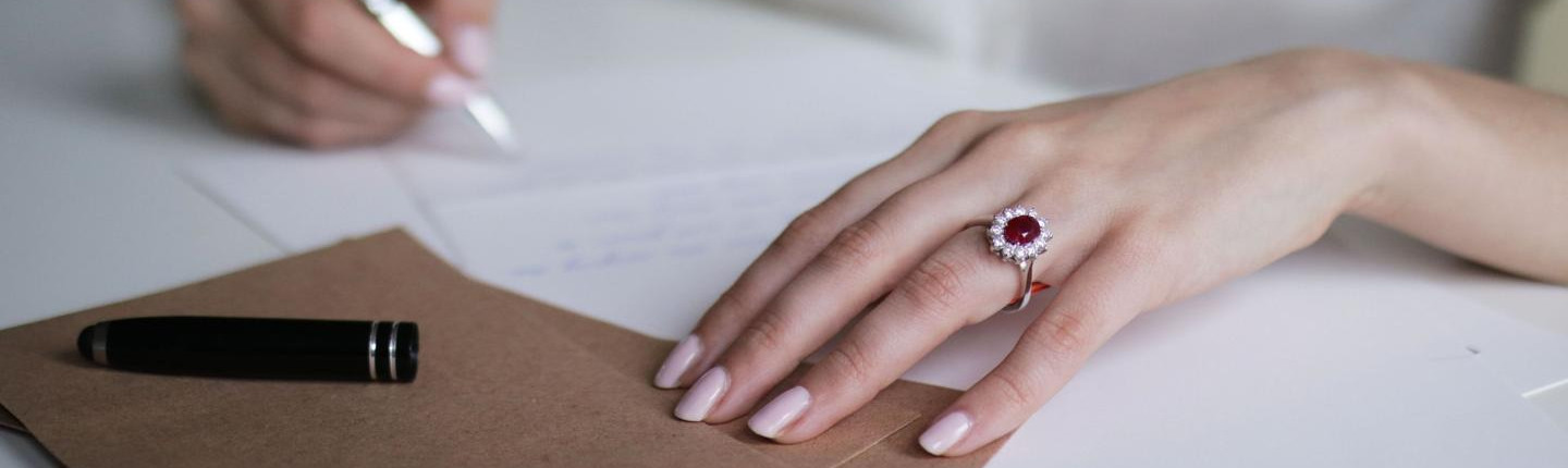 Woman with ring with red ruby - BAUNAT