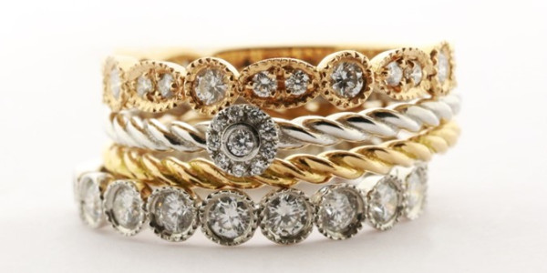 four engagement rings featuring diamonds, including a delicate thin band, showcasing exquisite craftsmanship