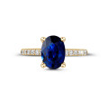 Oval safir ve yanları pırlantalı sarı altın yüzük