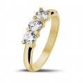 0.75 carat trilogy ring in yellow gold with round diamonds
