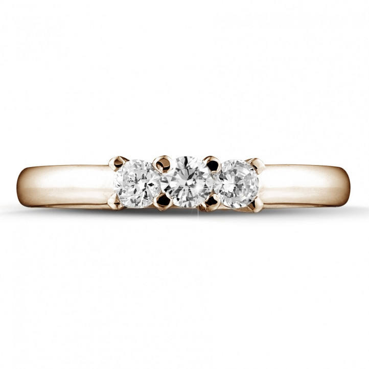 0.50 carat trilogy ring in red gold with round diamonds