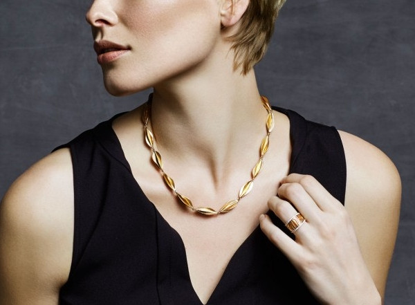 Woman wearing a statement necklace by BAUNAT